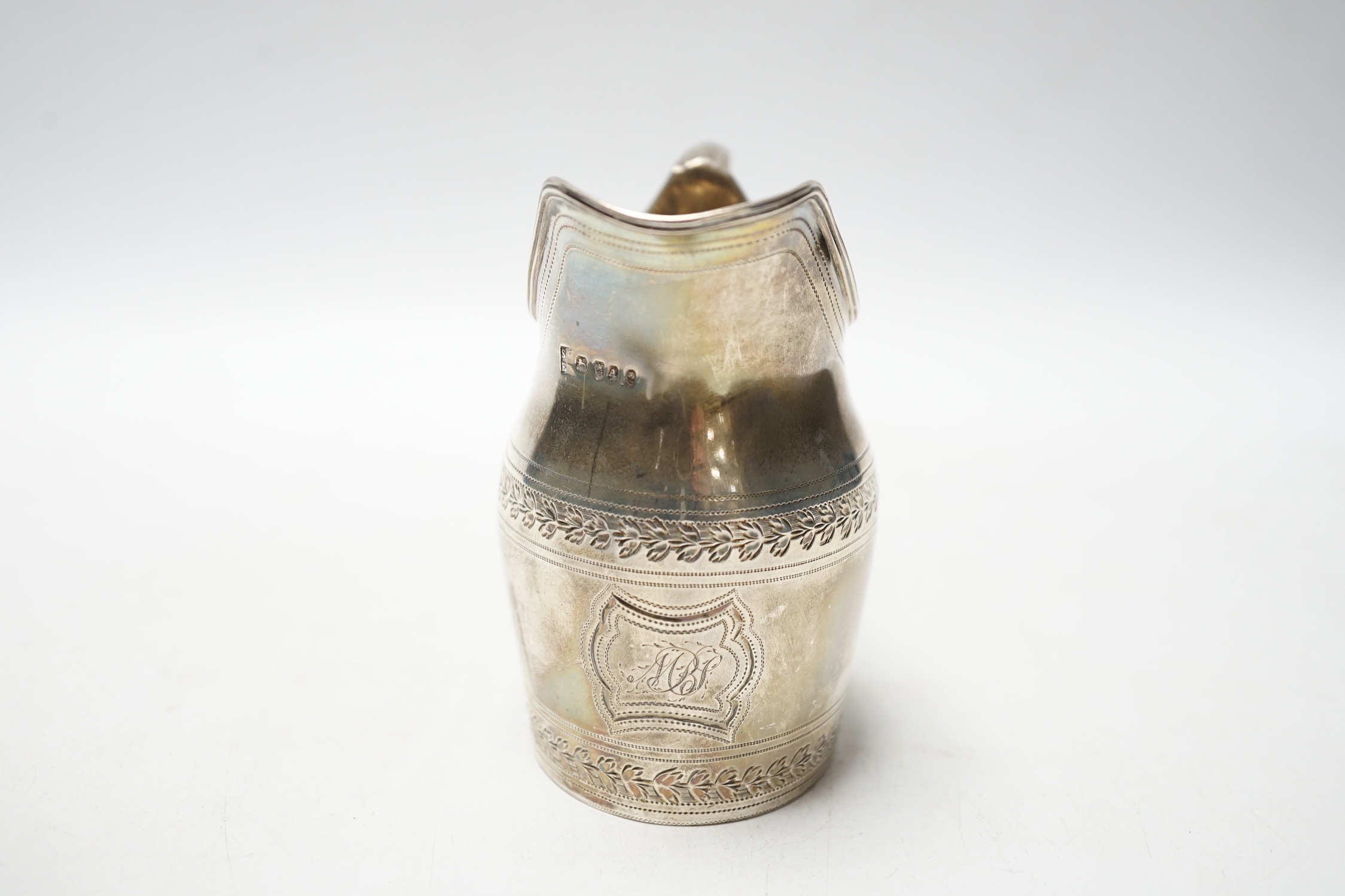 A George III silver engraved helmet shaped cream jug, Godbehere & Wigan, London, 1796, 10cm, 5.3oz.